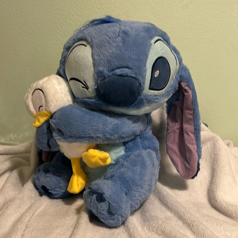 Disney's Stich hugging a Goose Large Stuffed Animal